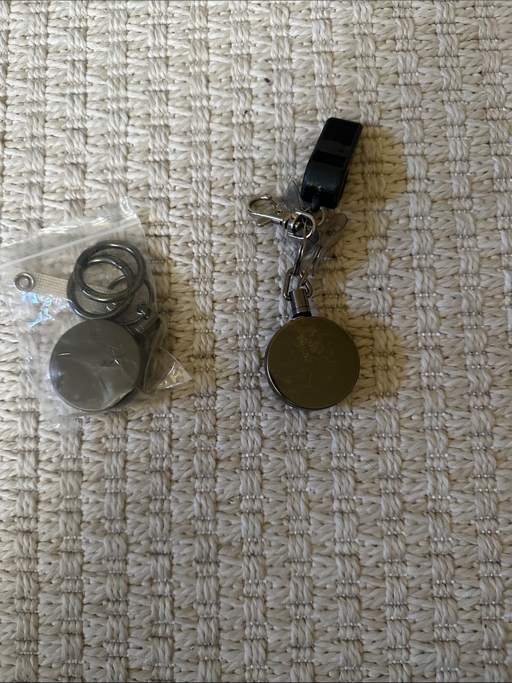 2- Black and Silver Retractable Badge Reel with Key Ring, 1 new and 1 used
